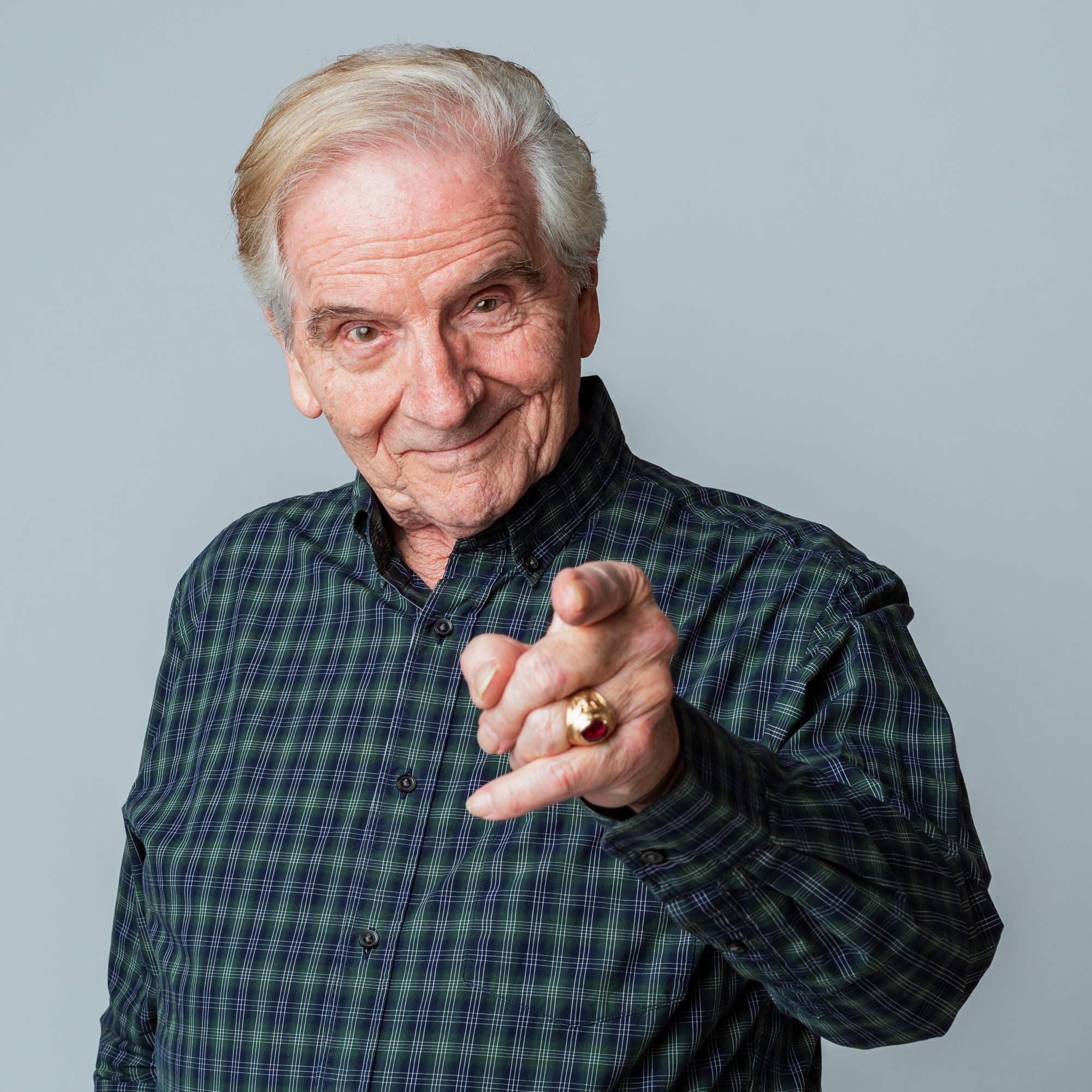 Happy senior man pointing at the camera